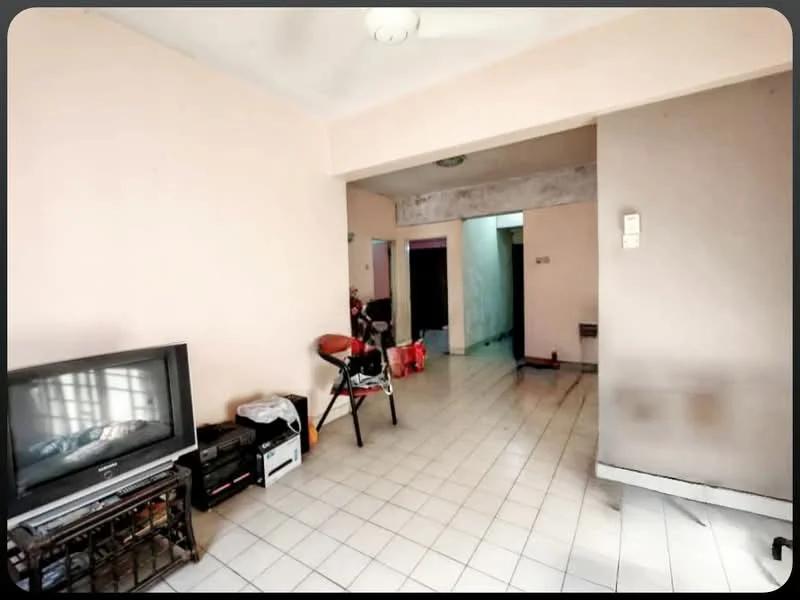 Living features: light-colored painted walls, white tiled flooring, ceiling fan, TV console, freestanding TV, wooden chair, small table, doorway leading to other rooms.