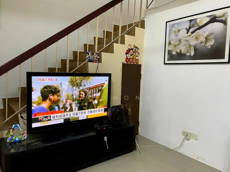 Living features: wall-mounted TV, black TV console, decorative wall art with floral design, staircase with wooden railing, cream painted walls, tile flooring, decorative figurines on TV console, framed artwork, wall clock; style: modern.