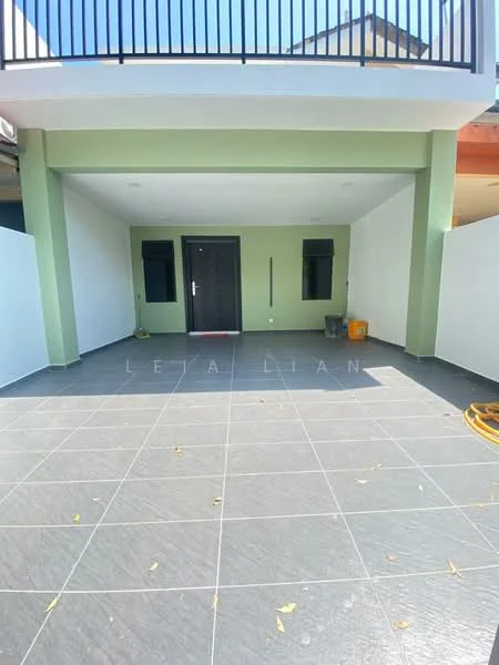 Exterior type: linked terrace house; features: grey tiled flooring, green accent wall, black front door, two windows on either side of the door, covered porch area, white walls, open space, no visible landscaping, sunny outdoor area; style: modern.