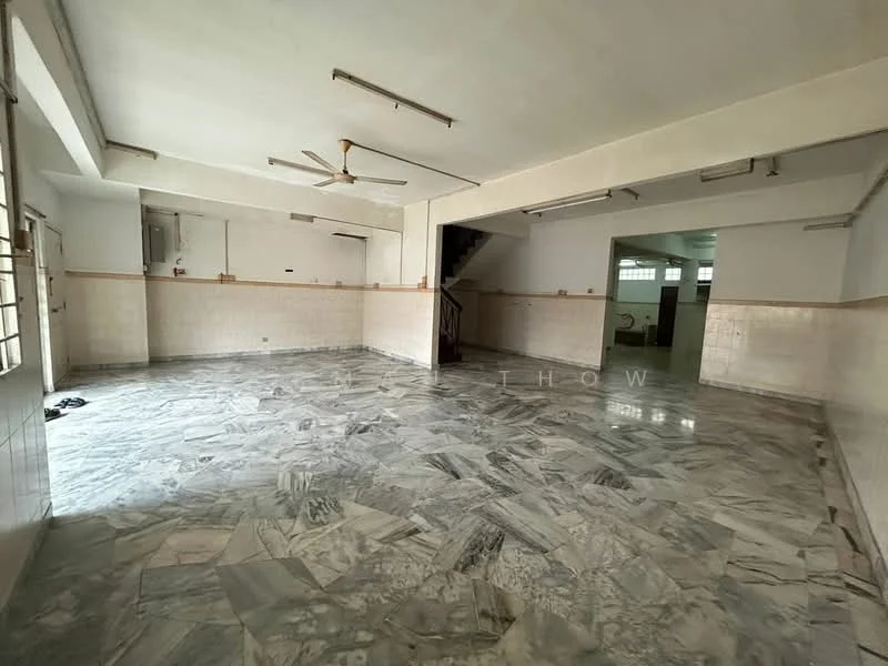 Room features: marble flooring, white painted walls, ceiling fan, multiple ceiling lights, staircase visible, large windows, open layout, tile cladding on lower walls.