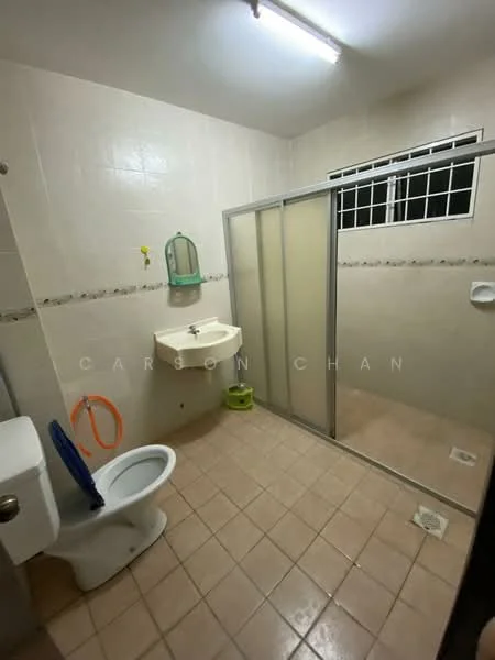 Bathroom features: white tiled walls, cream tiled flooring, single-sink vanity with wall-mounted mirror, toilet, walk-in shower with glass enclosure, shower head, window with metal grille, ceiling light fixture.