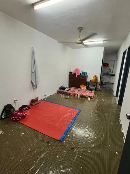 Room features: white painted walls, vinyl flooring, ceiling fan, unmade floor with scattered items, wooden dresser, blankets on the floor, cluttered space.