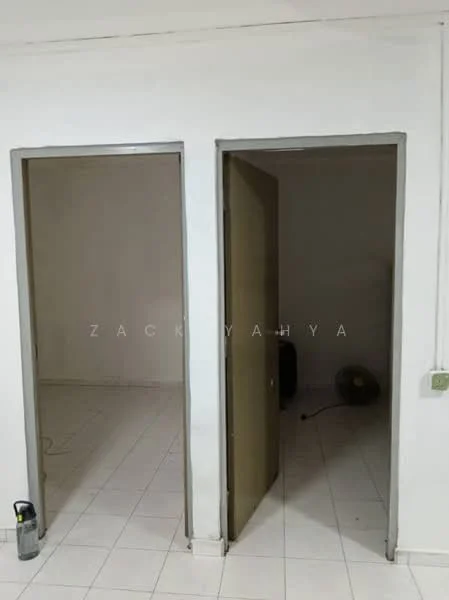 Room features: white painted walls, tile flooring, two doors, neutral color scheme, no visible furniture, single ceiling light, ventilation fan, empty space; style: minimalist.