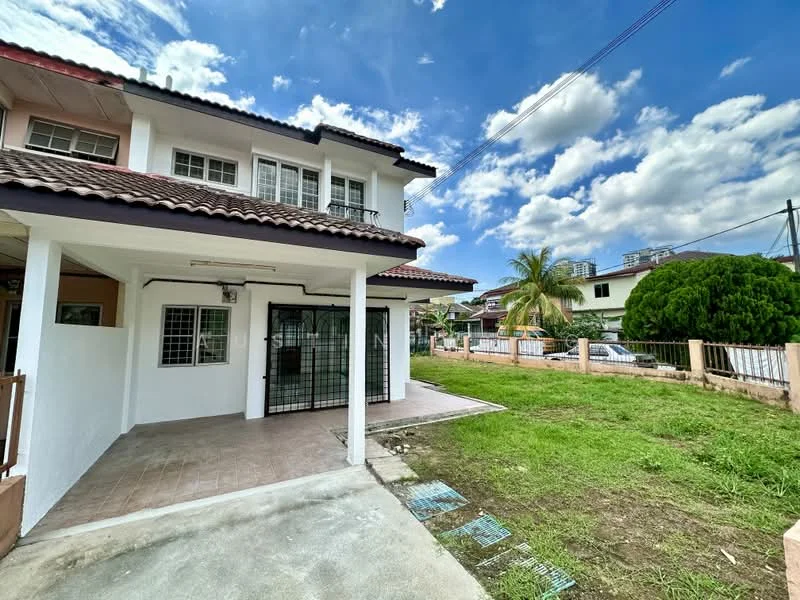 Exterior type: linked terrace house; features: white painted facade, red tiled roof, covered porch area, manicured lawn, paved walkway, fenced yard, surrounded by greenery, two-storey structure, large windows, gated entrance; style: modern.
