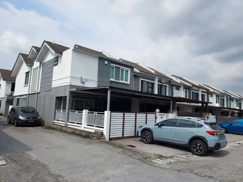 Exterior type: linked terrace house; features: white painted facade, grey accent wall, pitched tile roof, two-storey structure, car porch with awning, manicured lawn, driveway with interlocking pavers, surrounded by mature greenery; style: modern.