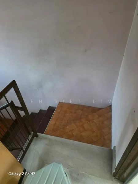 Room features: staircase with wooden railing, tiled flooring in terracotta color, plain white walls, concrete steps, landing area.