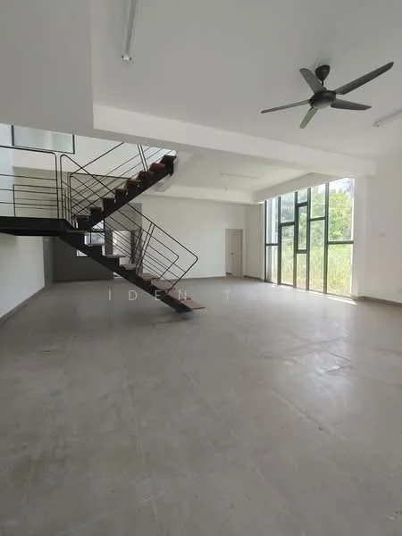 Room features: concrete flooring, white painted walls, exposed ceiling, 5-blade ceiling fan, large floor-to-ceiling windows, open space layout, staircase with metal railing, natural light from windows, view of greenery outside; style: modern; view: garden.
