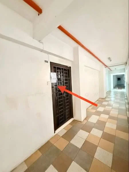 Room features: white painted walls, tile flooring with alternating beige and brown squares, metal security door, light fixtures on ceiling, hallway with multiple doors, arrow pointing to door.