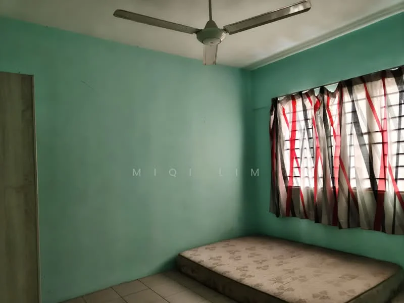 Room features: turquoise painted walls, white ceiling, ceiling fan, window with metal grille, curtains with red and black pattern, tiled flooring, mattress on the floor.