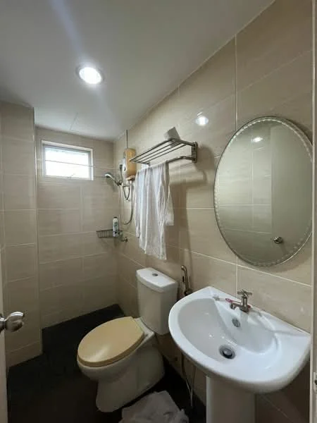 Bathroom features: white tiled walls, dark tiled flooring, round mirror, single-sink vanity with chrome faucet, one-piece toilet, shower area with handheld shower, towel rack, window for natural light, recessed ceiling lights; style: modern.