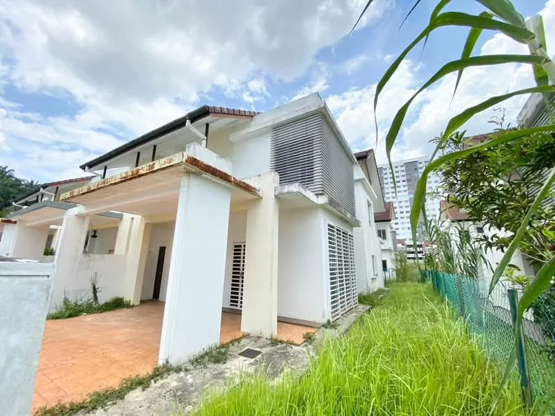 Exterior type: semi-detached house; features: white painted facade, terracotta roof tiles, sliding windows with horizontal slats, paved patio area, overgrown grass, surrounding greenery, fenced perimeter, two-storey structure; style: modern.