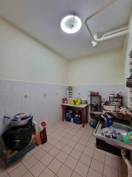 Kitchen features: white tiled walls, light-colored ceiling, square ceramic tile flooring, stainless-steel sink, countertop with storage underneath, kitchen cabinets, various kitchen appliances, open shelving, multiple storage containers, window with blinds.