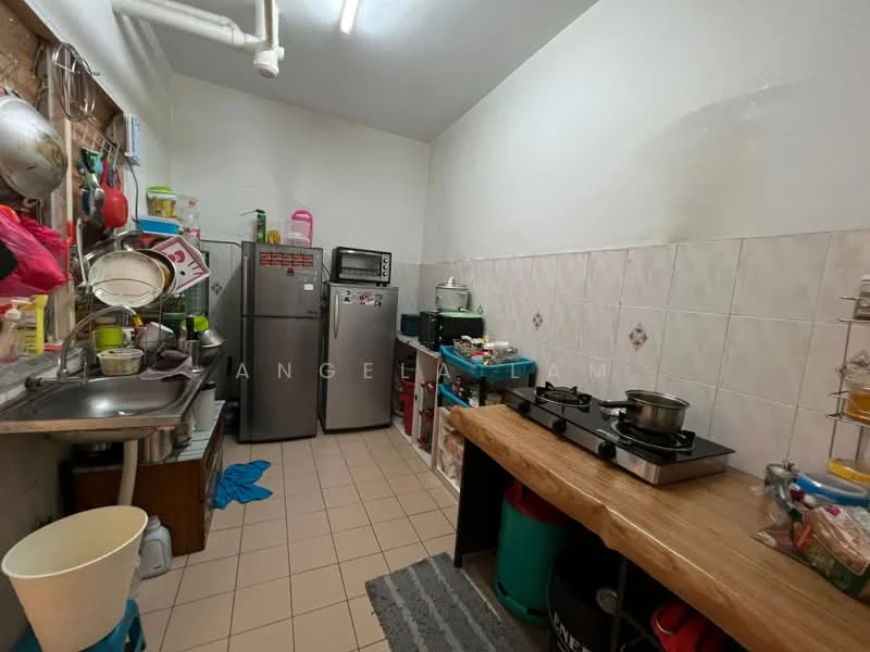 Kitchen features: stainless-steel sink, double-door fridge, built-in microwave, freestanding gas stove with 2 burners, wood countertop, white tiled walls, cream tiled flooring, open shelving, plastic storage bins, kitchen utensils, cooking pots, dish rack, waste bin.
