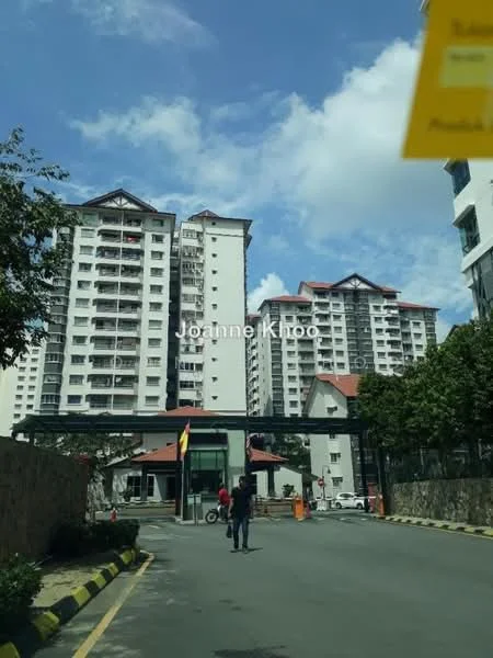 Exterior type: mid-rise condominium; features: multiple-storey buildings, gated entrance, landscaped greenery, paved driveway, security guardhouse, parking spaces, balconies on upper floors, clear blue sky, surrounded by trees; style: modern.