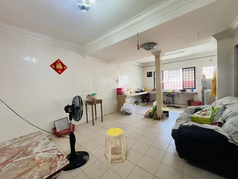 Living features: cream tiled flooring, white painted walls, crown moulding, ceiling fan, sofa in dark color, coffee table with marble top, decorative wall hanging, window with grid pattern, open layout to kitchen, light fixture on ceiling. Kitchen features: white tiled walls, kitchen countertop, sink, refrigerator, cooking area, various kitchen utensils, open shelving, floor-mounted cabinets.