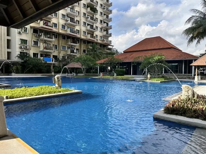 Exterior type: mid-rise condominium; features: swimming pool with fountains, landscaped garden, tropical landscaping with palm trees, pool deck with loungers, covered pavilion with traditional roof, manicured lawn, water features, multiple storeys visible in background, balconies on building facade; style: tropical-modern.