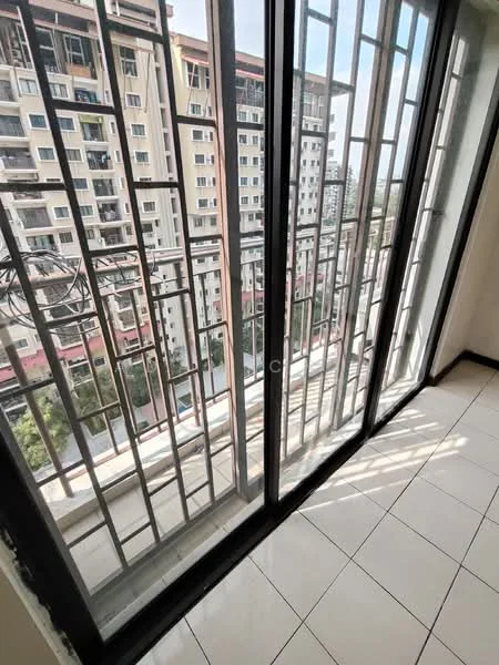 Room features: floor-to-ceiling windows, black metal window grills, white tiled flooring, natural light from outside, view of adjacent buildings, sliding glass door, corner window, open space; style: modern; view: city.