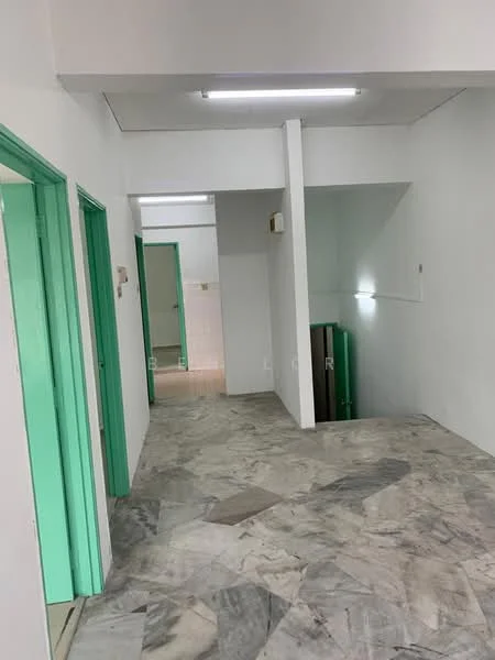 Room features: white painted walls, marble flooring, green doors, fluorescent ceiling lights, open layout, staircase, no visible furniture; style: minimalist.
