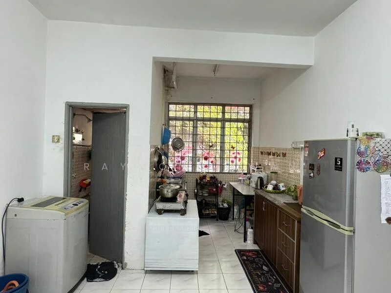 Kitchen features: white painted walls, white tiled flooring, single-bowl stainless-steel sink, chrome pull-down faucet, wood cabinetry, stainless-steel fridge, freestanding washing machine, stove with exhaust hood, countertop workspace, window with natural light, area rug with geometric pattern.