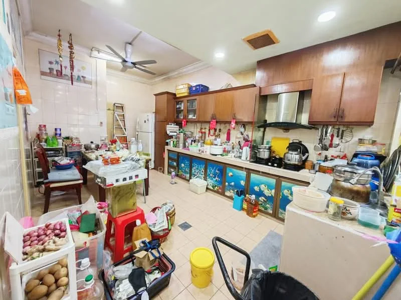 Kitchen features: wood cabinetry, stainless-steel sink, chrome pull-down faucet, built-in oven, freestanding range oven, microwave, refrigerator, tile flooring, ceiling fan, countertop with clutter, open shelving, multiple cooking pots, plastic storage containers, various kitchen utensils, wall-mounted cabinets.