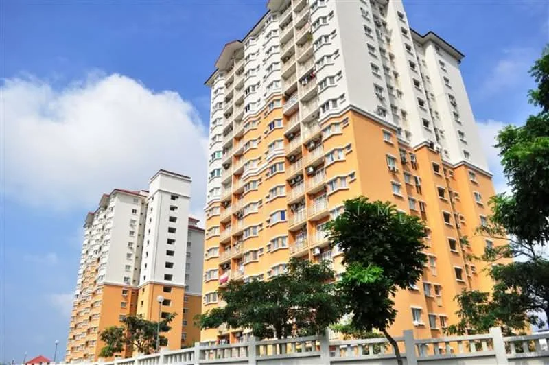 Exterior type: high-rise condominium; features: orange painted facade, white painted facade, multiple balconies, landscaped greenery in foreground, surrounded by trees, clear blue sky, modern architectural design; style: modern.