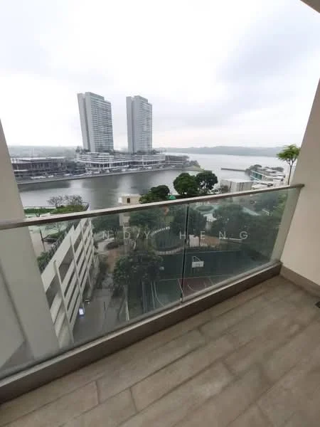 Room features: glass balcony railing, grey tiled flooring, city skyline view, river view, two high-rise buildings in view, greenery visible below, outdoor space; style: modern; view: city.