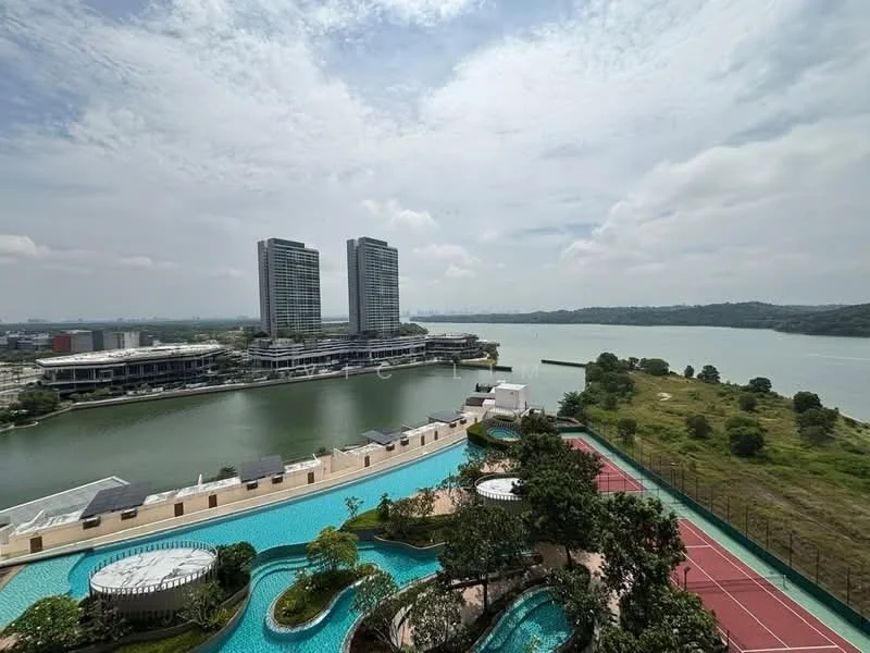 Exterior type: high-rise condominium; features: infinity pool, swimming pool deck with loungers, landscape garden, tennis court, manicured lawn, waterfront view, surrounded by greenery, modern architectural design, two high-rise buildings, city skyline in background; style: modern.
