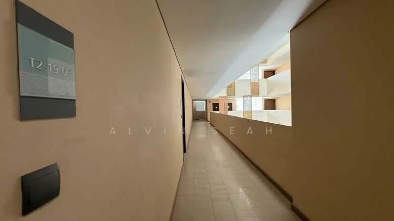 Room features: cream painted walls, tile flooring, indirect lighting, numbered door plaque, open corridor, balcony access visible, natural light from windows, neutral color scheme; style: modern.