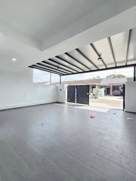Room features: white painted walls, grey tile flooring, exposed metal beams on ceiling, large opening to exterior, natural light from exterior, sliding gate visible, concrete floor, no visible furniture or decor; style: modern; view: garden.