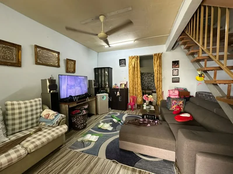 Living features: 3-seater fabric sofa in grey, 2-seater fabric sofa with checkered pattern, coffee table, wall-mounted TV, TV console, area rug with geometric pattern, ceiling fan, wooden staircase, decorative wall art, curtains in yellow, basket for storage, various decorative items.