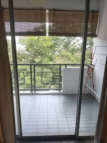 Room features: sliding glass door, bamboo blinds, grey tiled flooring, balcony railing, clothes drying rack, greenery view; view: garden.