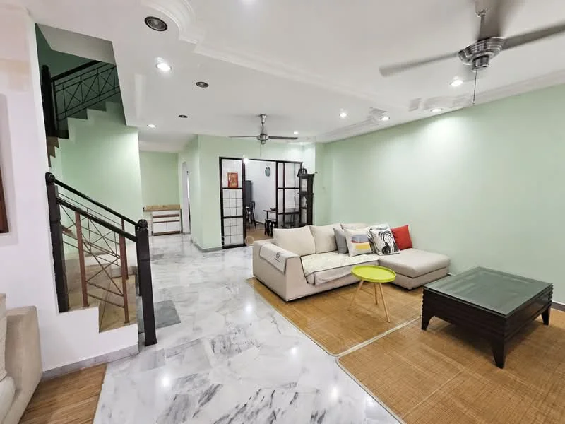 Living features: marble tile flooring, light green painted walls, tray ceiling with recessed lighting, 5-blade ceiling fan, L-shape sectional sofa in beige, decorative cushions, glass coffee table, bamboo area rug, wall-mounted TV, open shelving unit, sliding door to adjacent room; style: modern. Room features: staircase with metal railing, light green painted walls, wooden countertop in background.