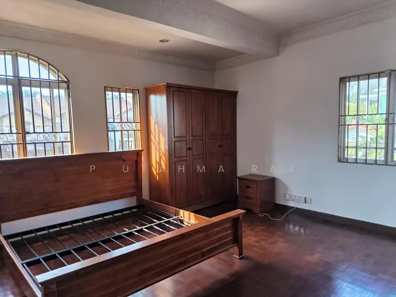 Bedroom features: wooden flooring, white painted walls, crown moulding, large windows with metal grills, built-in wooden wardrobe, bed frame without mattress, natural light from windows, high ceiling; style: modern; view: garden.