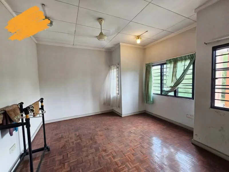 Room features: parquet wood flooring, white painted walls, ceiling fan, window with green curtains, two small windows, light fixture, clothes rack, corner of the room with no visible furniture.