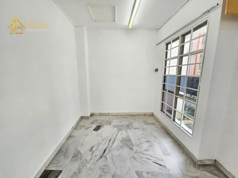 Room features: white painted walls, marble flooring, ceiling with fluorescent lighting, large windows with multiple panes, window treatments not visible, corner of room with visible outdoor view, no visible furniture or decor.