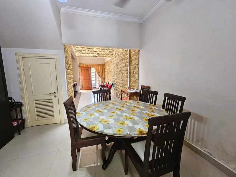 Dining features: round dining table with floral tablecloth, wooden dining chairs, cream painted walls, tile flooring, ceiling fan, door leading to hallway, natural light from adjacent room, decorative wall with stone cladding; style: modern. Room features: staircase visible in background, wooden door leading to another room.
