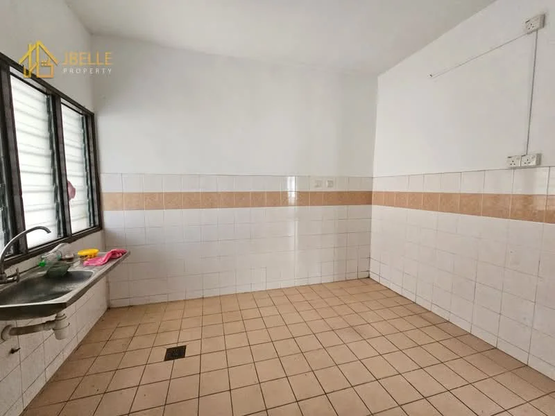 Kitchen features: single-bowl stainless-steel sink, chrome faucet, white tiled walls with beige accent tiles, light beige floor tiles, window with horizontal slats, open layout, no visible cabinetry, no visible appliances.