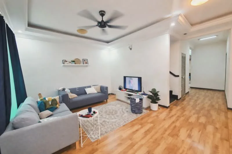 Living features: grey fabric sofa, area rug with geometric pattern, white TV console, wall-mounted TV, ceiling fan, wooden flooring, decorative wall shelf, green accent pillows, potted plant, black curtains, white walls, recessed lighting; style: modern. Hallway features: wooden flooring, white walls, staircase, doorway to other rooms.