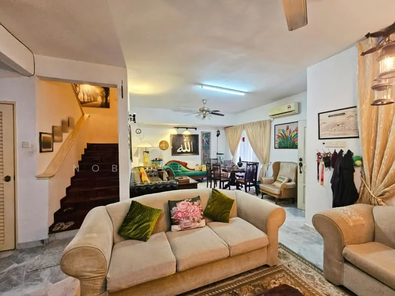 Living features: 3-seater fabric sofa in beige, 2 armchairs in beige, coffee table, area rug with intricate pattern, ceiling fan with light, wall-mounted air conditioning unit, decorative wall art, curtains in light beige, wall clock, decorative plants, light marble flooring, recessed lighting; style: traditional. Dining features: dining table with 4 chairs, wall-mounted artwork, curtains in light beige, light marble flooring; style: traditional. Staircase features: wooden staircase, decorative wall art, light marble flooring; style: traditional.