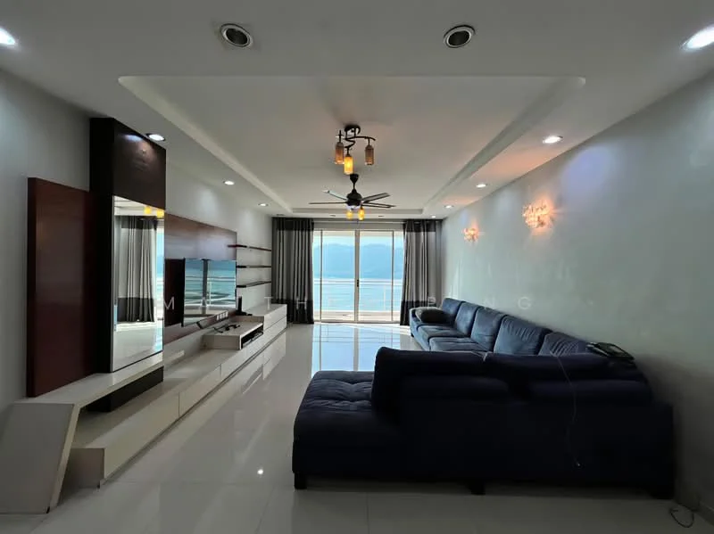 Living features: L-shape sectional sofa in navy blue, white glossy tile flooring, recessed downlights, 5-blade ceiling fan with light, wall-mounted TV console, large floor-to-ceiling windows, curtains in grey, decorative wall sconces, mirror accent wall, ocean view; style: modern; view: sea.