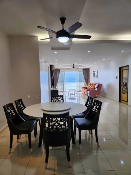Dining features: round dining table, 4 black dining chairs with decorative backs, 5-blade ceiling fan with light, cream tiled flooring, large windows with sea view, curtains, recessed lighting, open layout to living area; style: modern; view: sea. Living features: 2-seater fabric sofa in orange, coffee table, large windows with sea view, curtains, cream tiled flooring, recessed lighting; style: modern; view: sea.