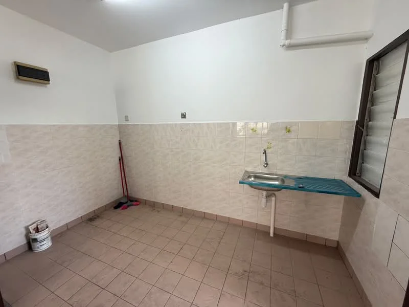 Laundry features: single-bowl stainless-steel sink, white tiled walls, light beige tiled flooring, wall-mounted air conditioning unit, window with sliding shutters, blue rubber mat on countertop, cleaning supplies visible, plumbing fixtures.