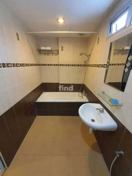 Bathroom features: bathtub, shower head, wall-mounted faucet, single-sink vanity, mirror, tile flooring, cream tiled walls, brown accent tiles, shelf for toiletries, window for natural light; style: modern.