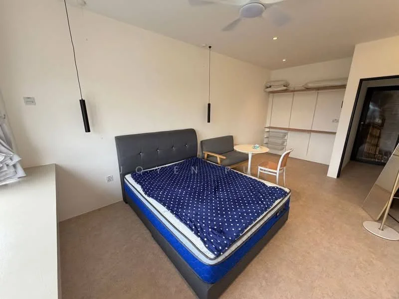 Bedroom features: queen-size bed with blue mattress and polka dot bedding, 2 pendant lights hanging from the ceiling, ceiling fan, light-colored walls, laminate flooring, small round dining table, white chair, built-in wardrobe, window with sheer curtains; style: modern.