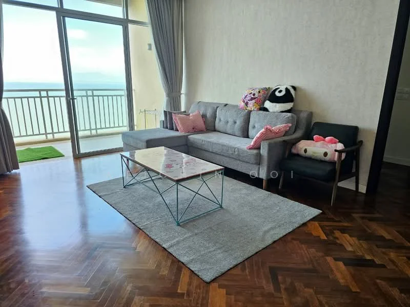 Living features: L-shape sectional sofa in grey, pink decorative pillows, coffee table with geometric metal base, area rug in light grey, wooden flooring in herringbone pattern, floor-to-ceiling windows, curtains in light fabric, balcony access, decorative plush toys; style: modern; view: sea.