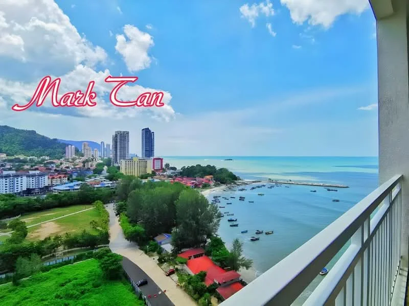 Exterior type: high-rise condominium; features: sea view, city skyline, greenery in foreground, boats in water, surrounding buildings, clear blue sky, clouds, coastal area; style: modern.