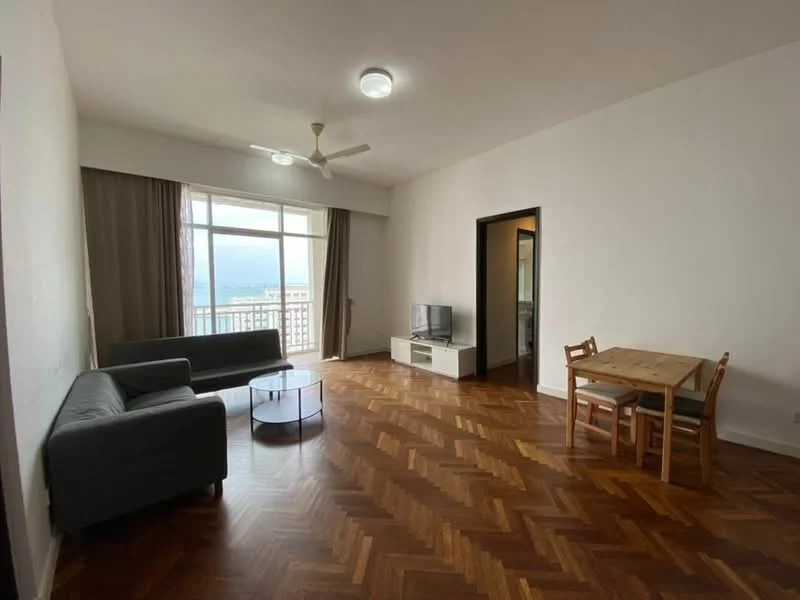 Living features: herringbone parquet wood flooring, white painted walls, 5-blade ceiling fan with light, floor-to-ceiling windows, sliding glass door, curtains, grey fabric 3-seater sofa, grey fabric 2-seater sofa, round glass coffee table, TV console, wall-mounted TV, dining table with 4 chairs; style: modern; view: sea.