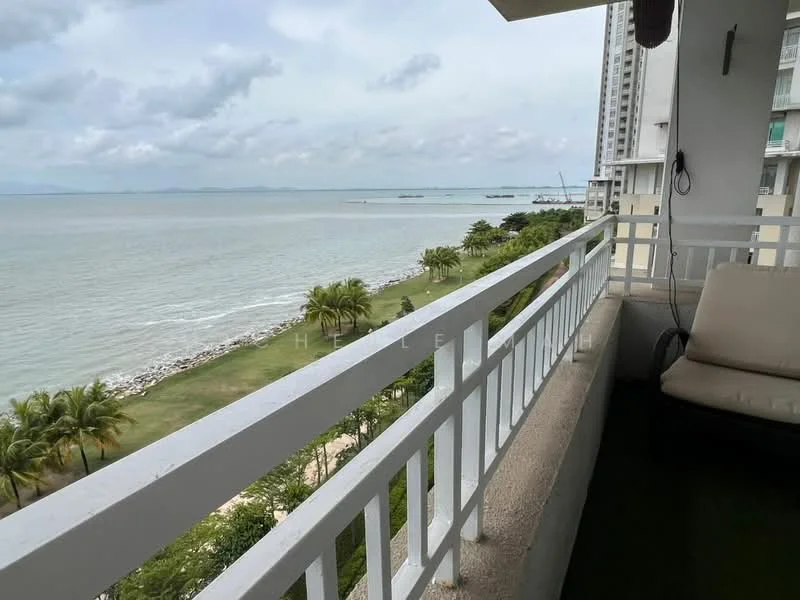 Room features: balcony with railing, sea view, palm trees visible, green lawn visible, concrete flooring, outdoor seating area, overcast sky; view: sea.