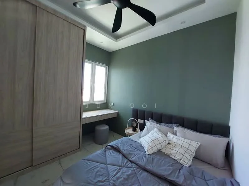 Bedroom features: king-size bed with grey bedding, upholstered headboard, wooden wardrobe with sliding doors, green accent wall, white painted walls, ceiling fan with 3 blades, window with natural light, study desk with chair, decorative cushions, laminate flooring; style: modern.