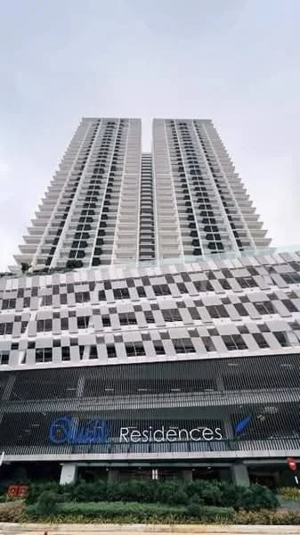 Exterior type: high-rise condominium; features: glass curtain wall, white painted facade, exposed concrete facade, recessed balconies, vertical fins, feature lighting at night, manicured landscaping, multi-storey car park, double-volume main lobby; style: modern.